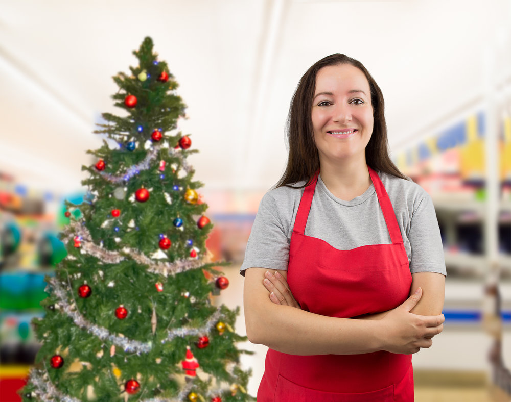 portrait of a saleswoman with crossed arms on Christmas