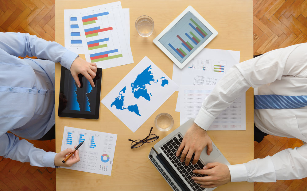 Businessman and businesswoman using digital tablet in the meeting.